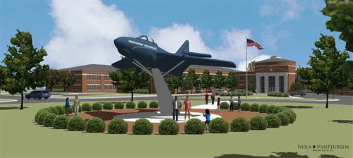 rendering of jet atop a pedestal with the school in the background